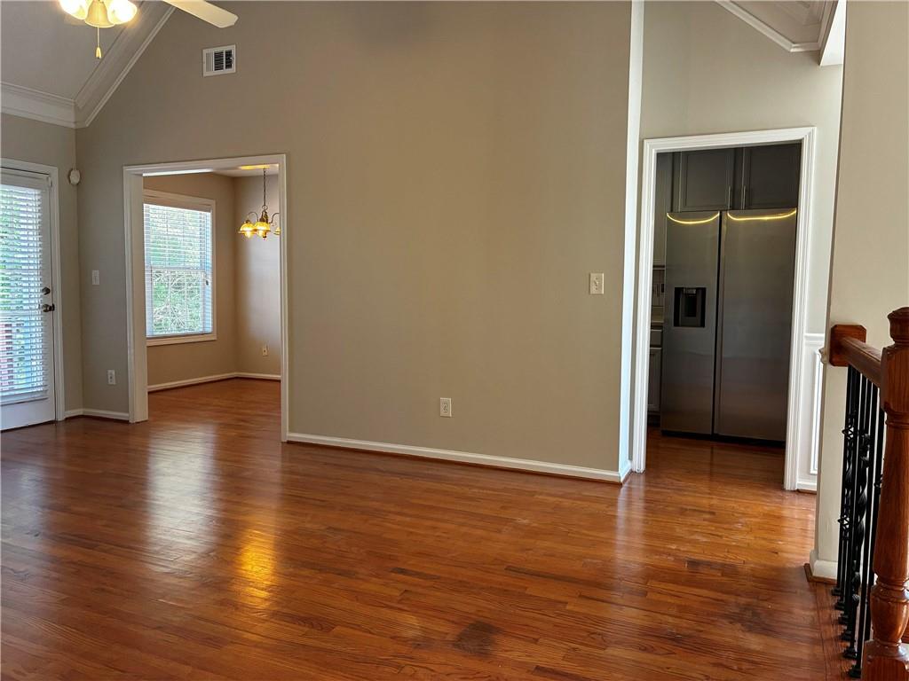 337 Madison Avenue Hampton, GA 30228 - Photo 8 of 32 an empty room with wooden floor and closet