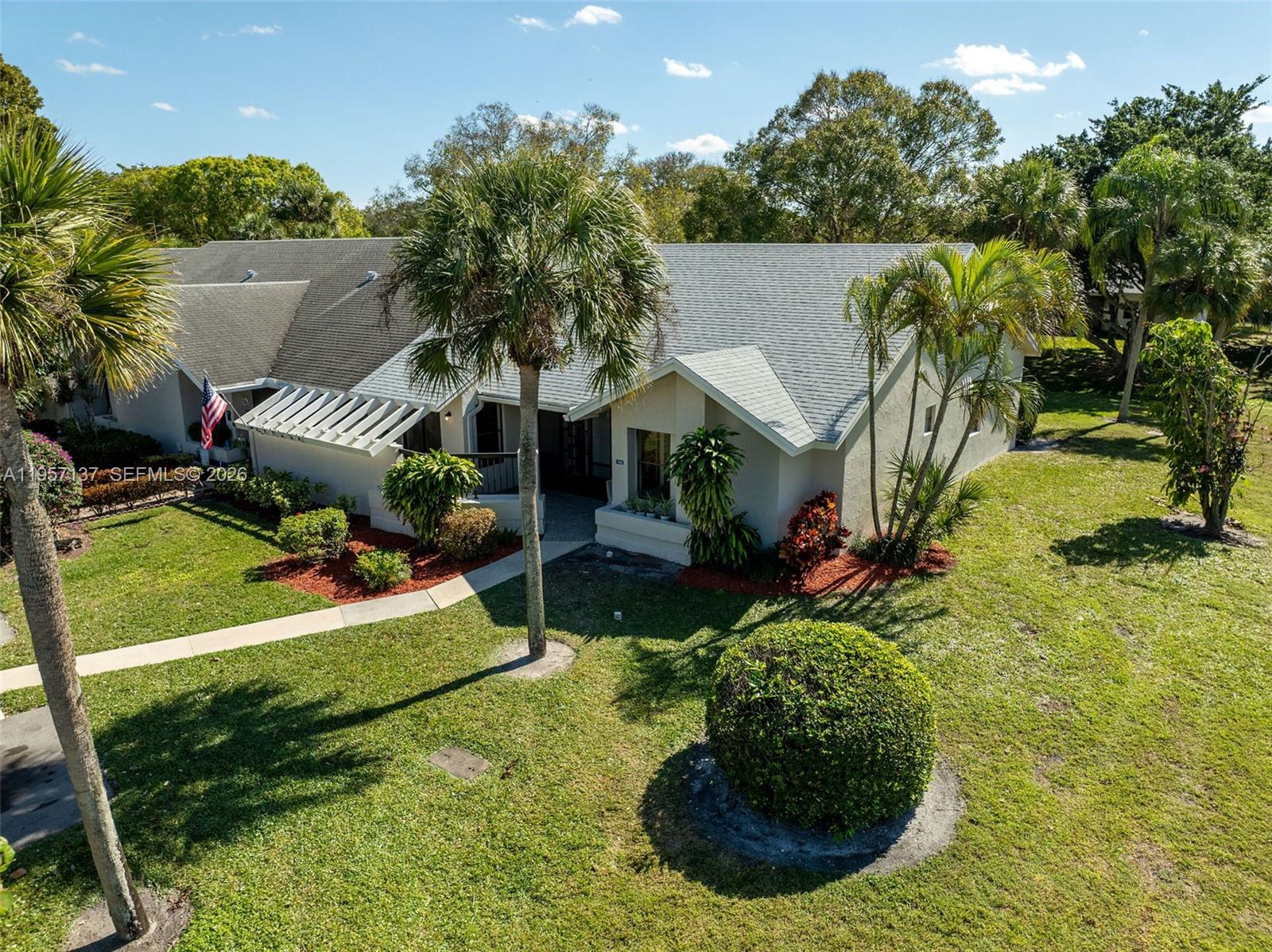10988 Lake Front Place Boca Raton, FL 33498 - Photo 1 of 85 a view of a house with a swimming pool and sitting area