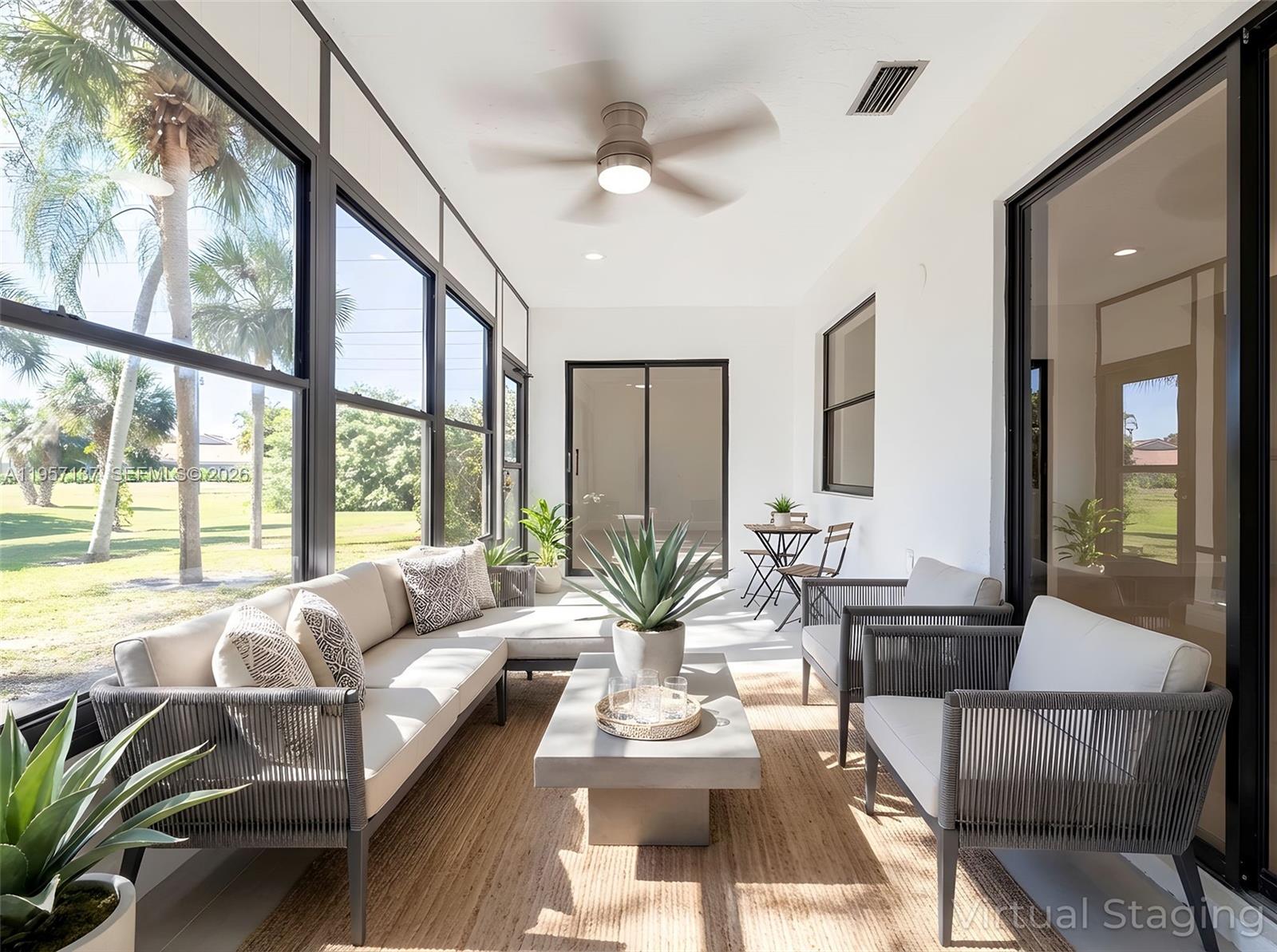 10988 Lake Front Place Boca Raton, FL 33498 - Photo 11 of 85 a living room with furniture and a large window