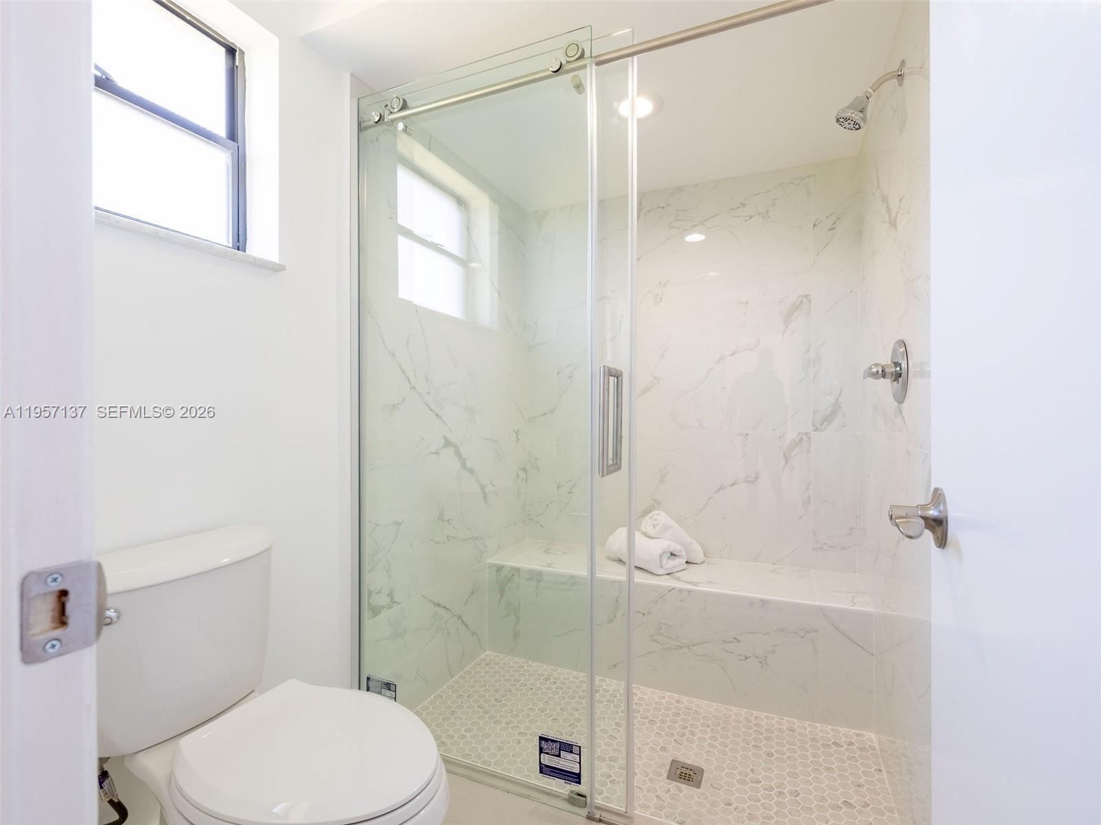 10988 Lake Front Place Boca Raton, FL 33498 - Photo 18 of 85 a bathroom with a shower and a toilet