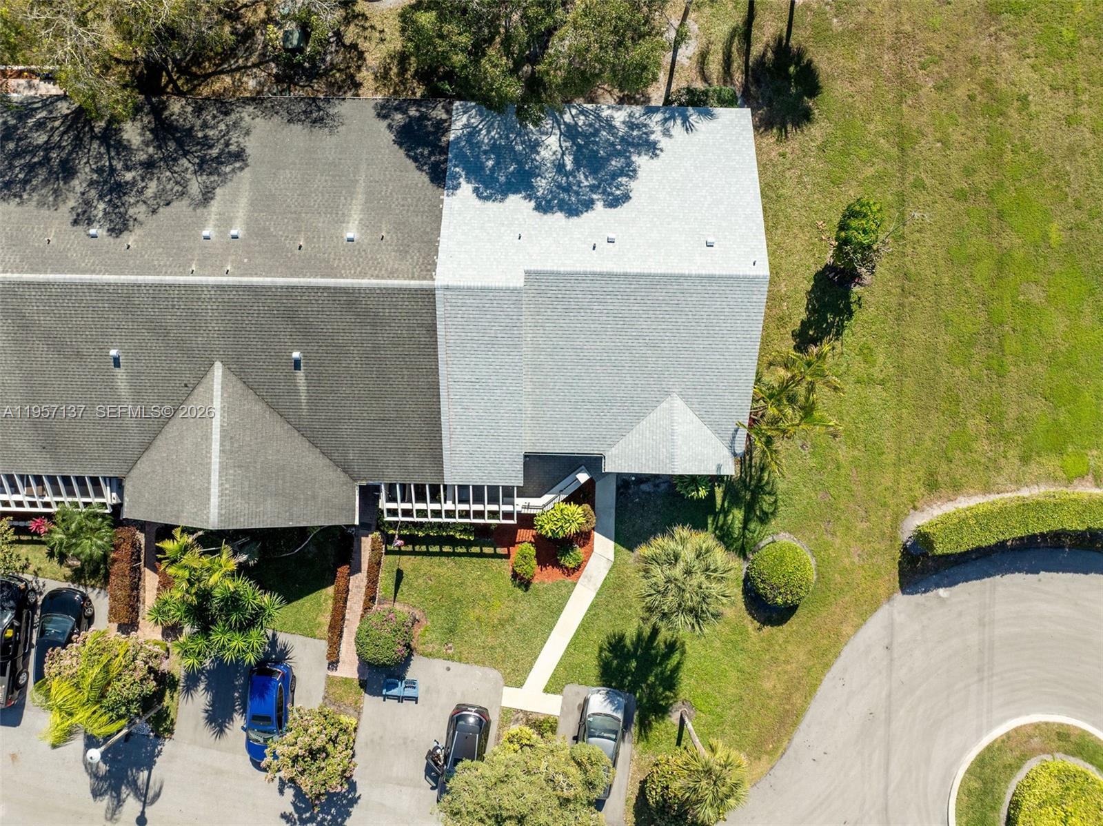 10988 Lake Front Place Boca Raton, FL 33498 - Photo 2 of 85 an aerial view of a house with swimming pool and large trees