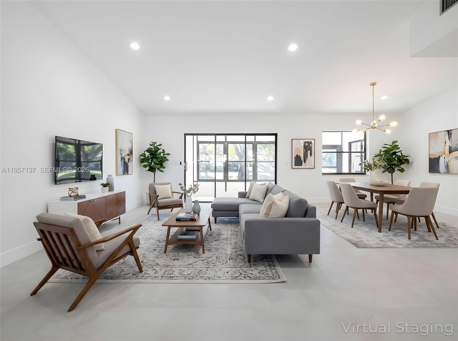 10988 Lake Front Place Boca Raton, FL 33498 - Photo 3 of 85 a living room with furniture and a flat screen tv