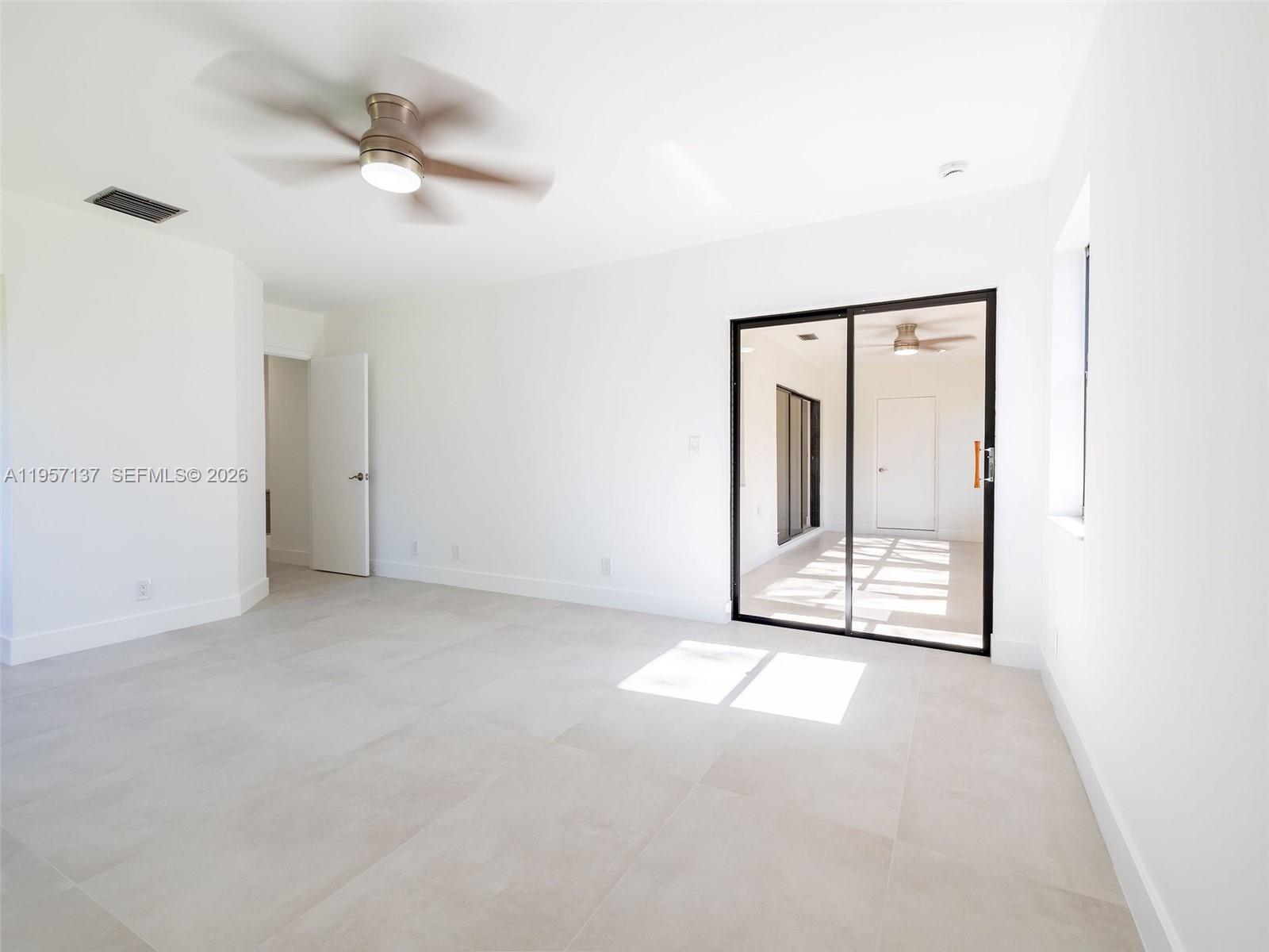 10988 Lake Front Place Boca Raton, FL 33498 - Photo 38 of 85 Primary Bedroom overlooking the Florida room