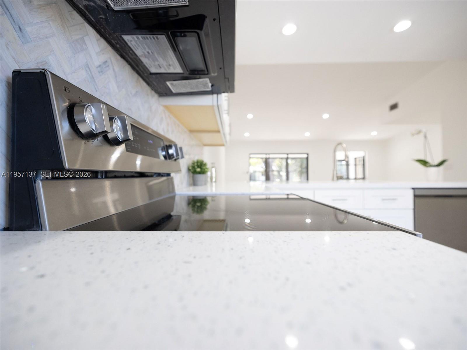 10988 Lake Front Place Boca Raton, FL 33498 - Photo 50 of 85 a view of a kitchen with a sink and cabinets