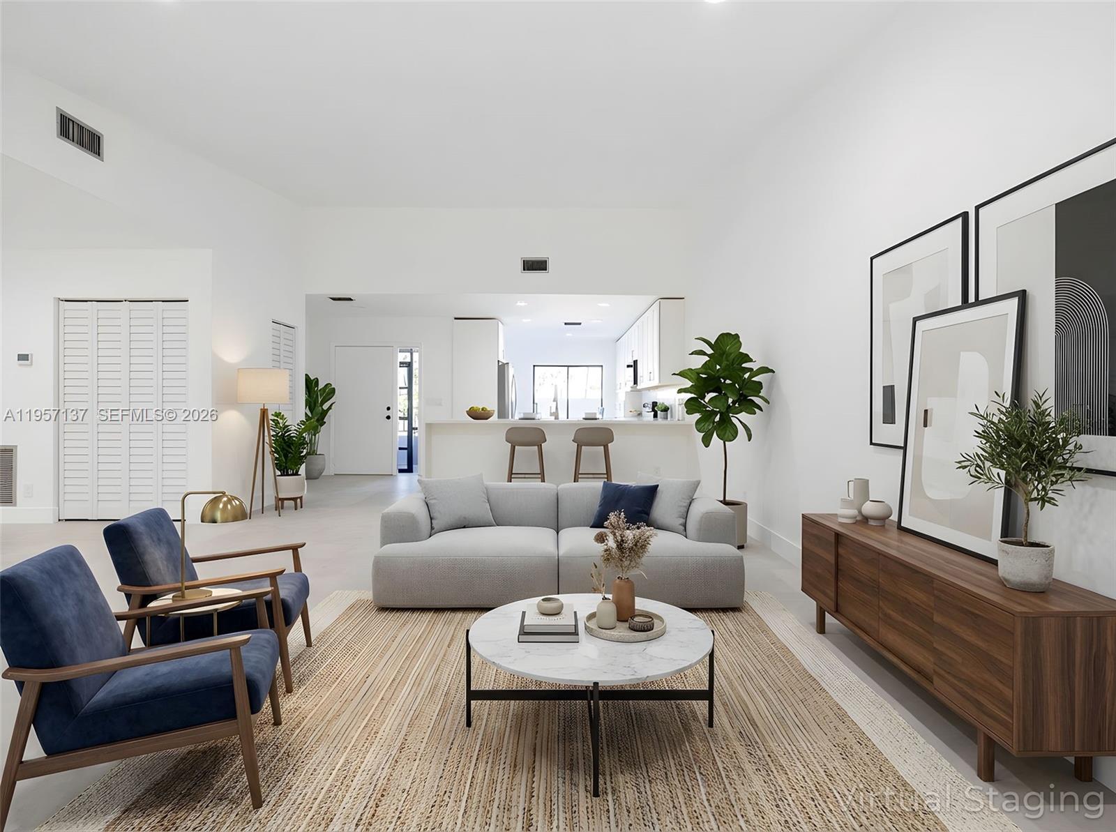 10988 Lake Front Place Boca Raton, FL 33498 - Photo 6 of 85 a living room with furniture and a potted plant