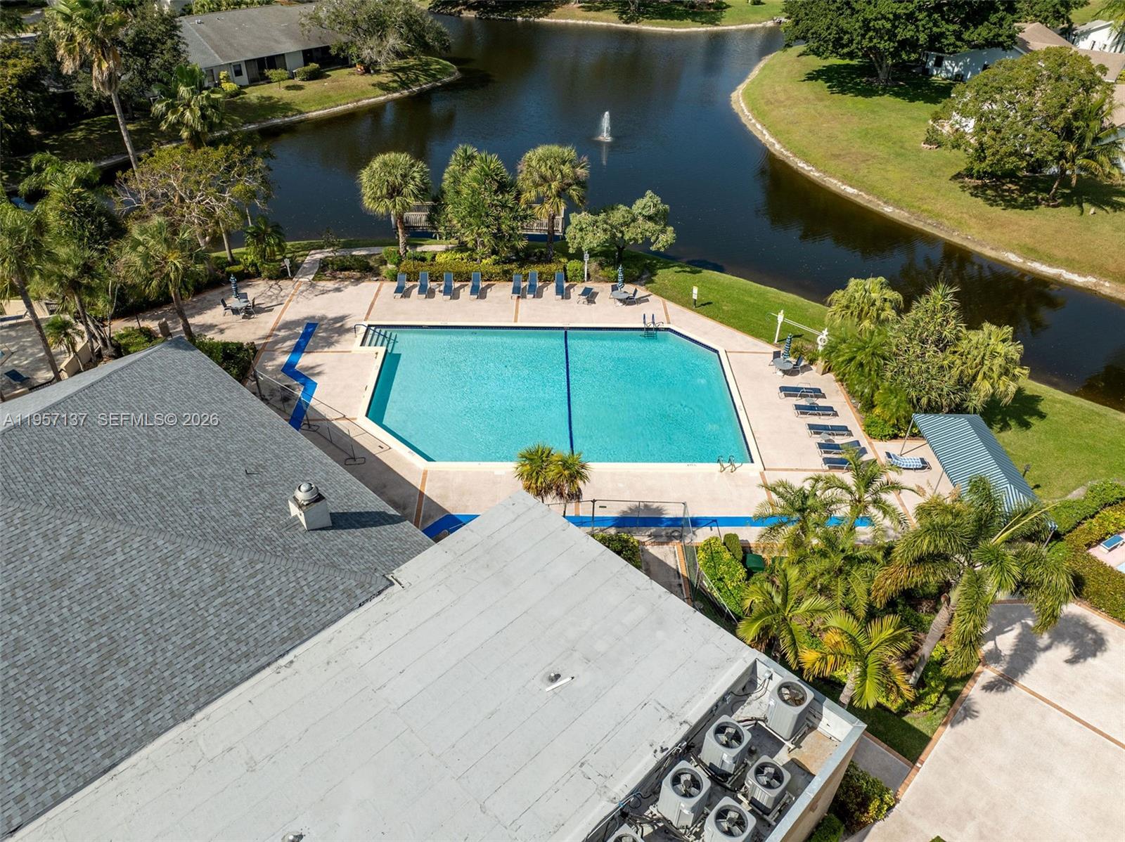 10988 Lake Front Place Boca Raton, FL 33498 - Photo 76 of 85 an aerial view of a house with a lake view