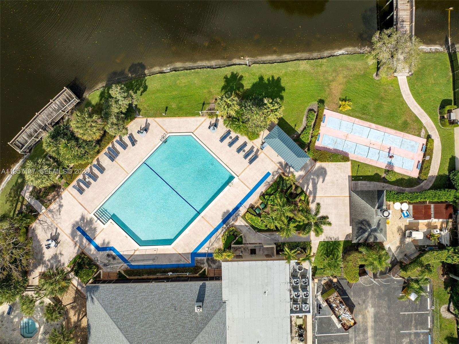 10988 Lake Front Place Boca Raton, FL 33498 - Photo 78 of 85 an aerial view of a house with a yard and outdoor seating
