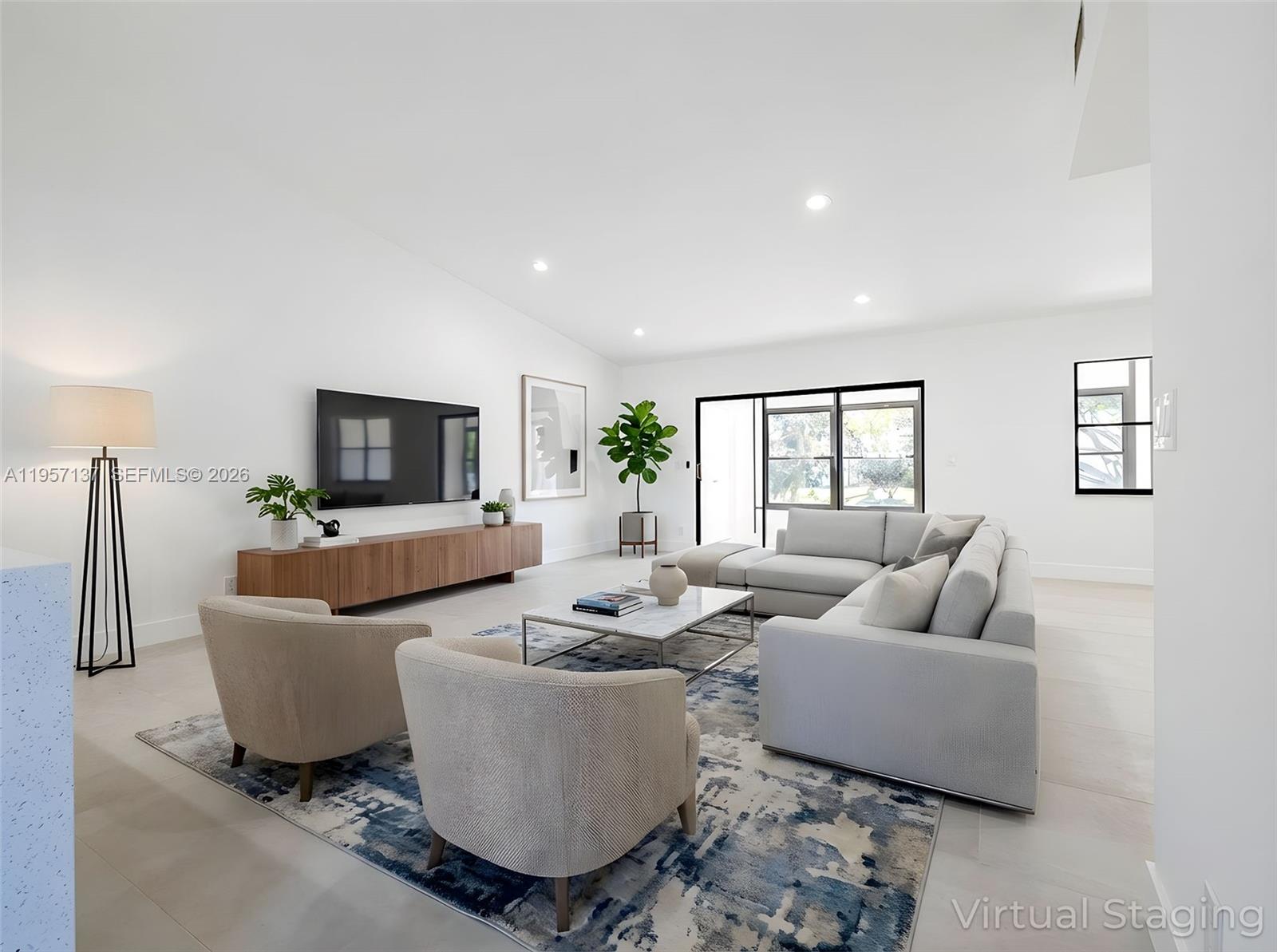 10988 Lake Front Place Boca Raton, FL 33498 - Photo 85 of 85 a living room with furniture and a flat screen tv