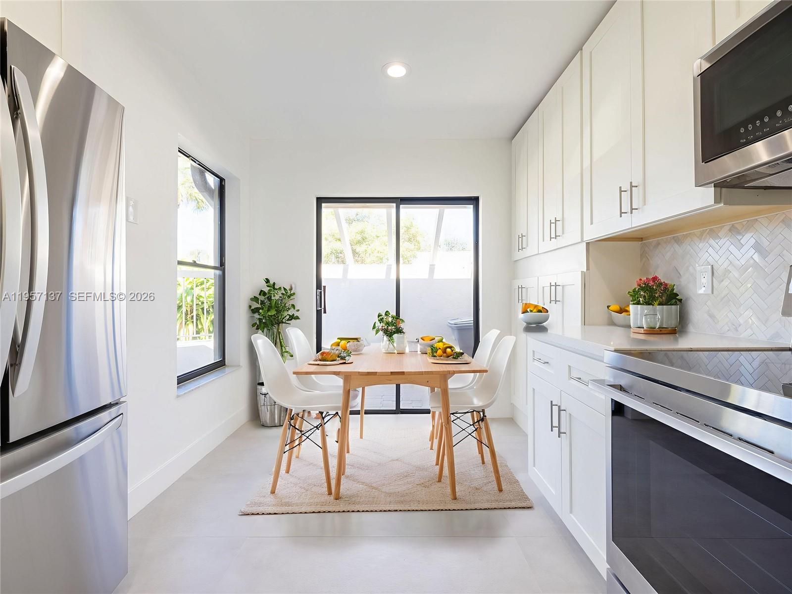10988 Lake Front Place Boca Raton, FL 33498 - Photo 10 of 85 a view of a dining room with furniture window and outside view
