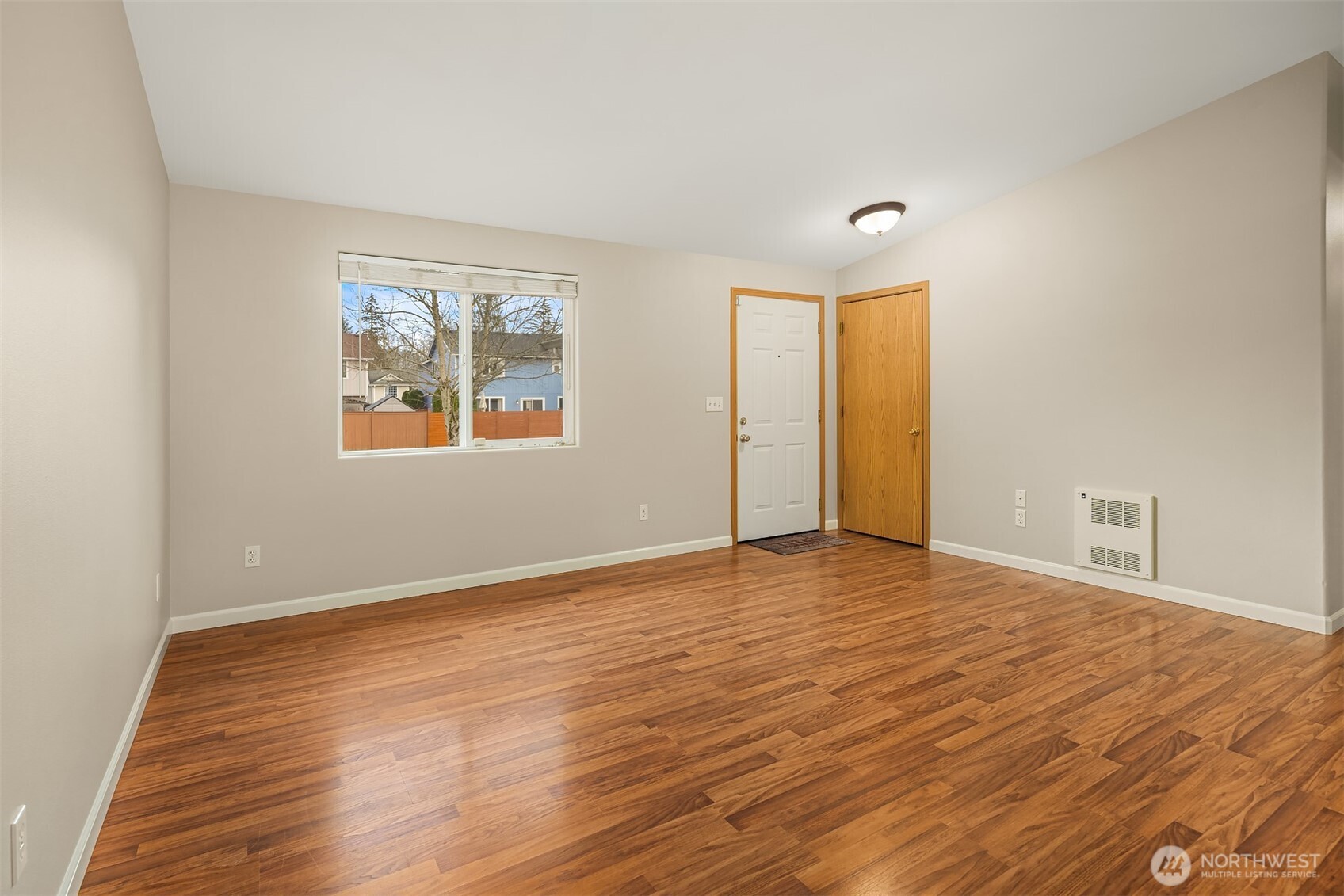 1019 Kessler Drive Sultan, WA 98294 - Photo 16 of 28 a view of an empty room with wooden floor and a window
