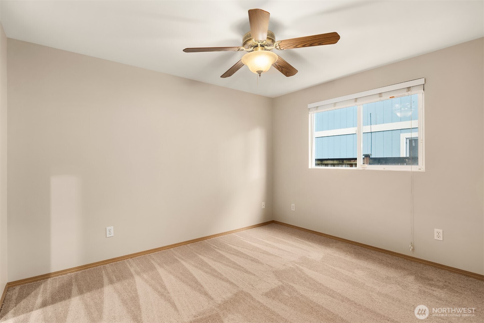 1019 Kessler Drive Sultan, WA 98294 - Photo 21 of 28 an empty room with a window and a fan