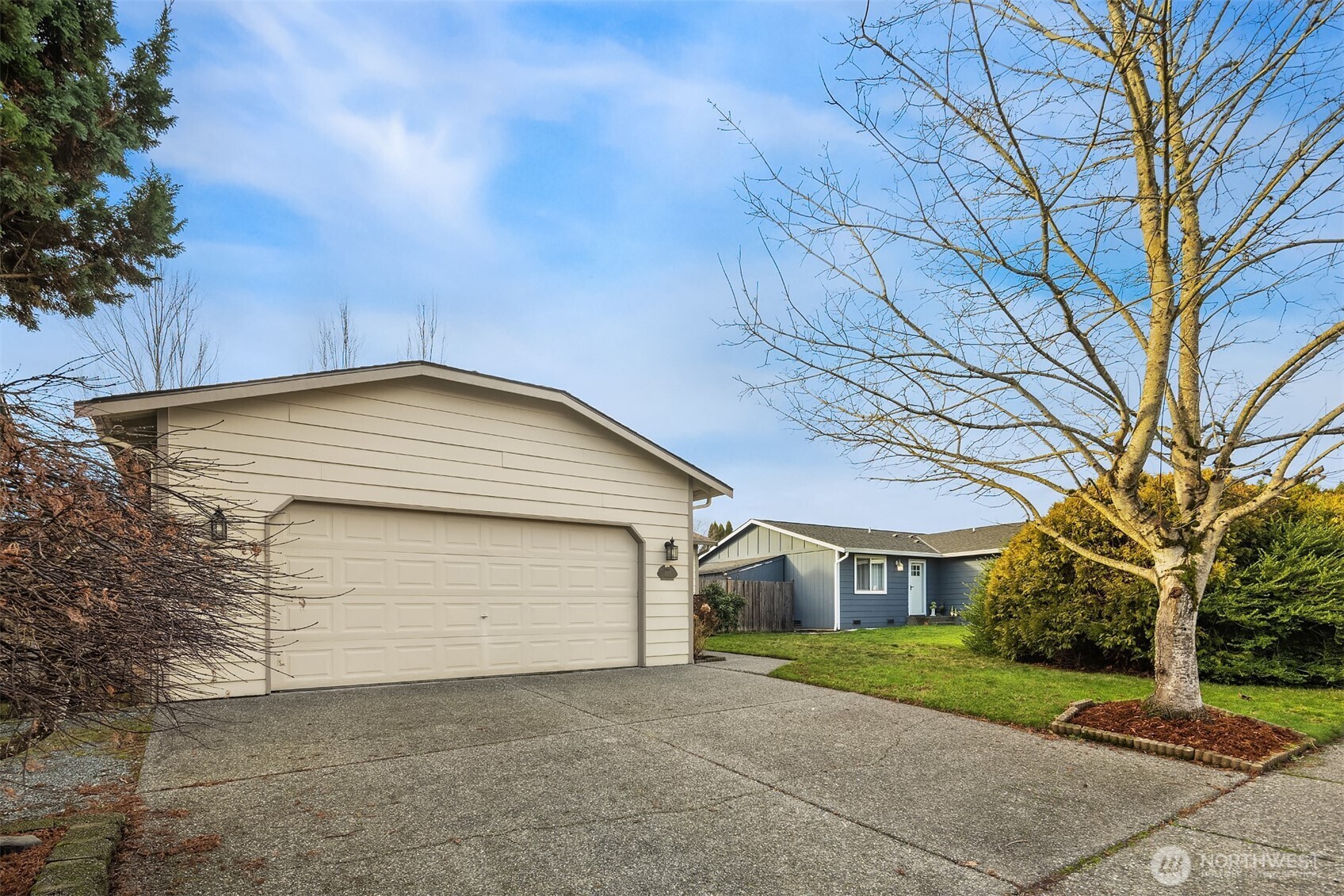 1019 Kessler Drive Sultan, WA 98294 - Photo 28 of 28 a front view of a house with a yard and garage