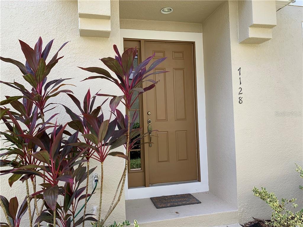 7128 Forty Banks Road, Unit 38A Harmony, FL 34773 - Photo 1 of 1 a view of a potted plant with a tree