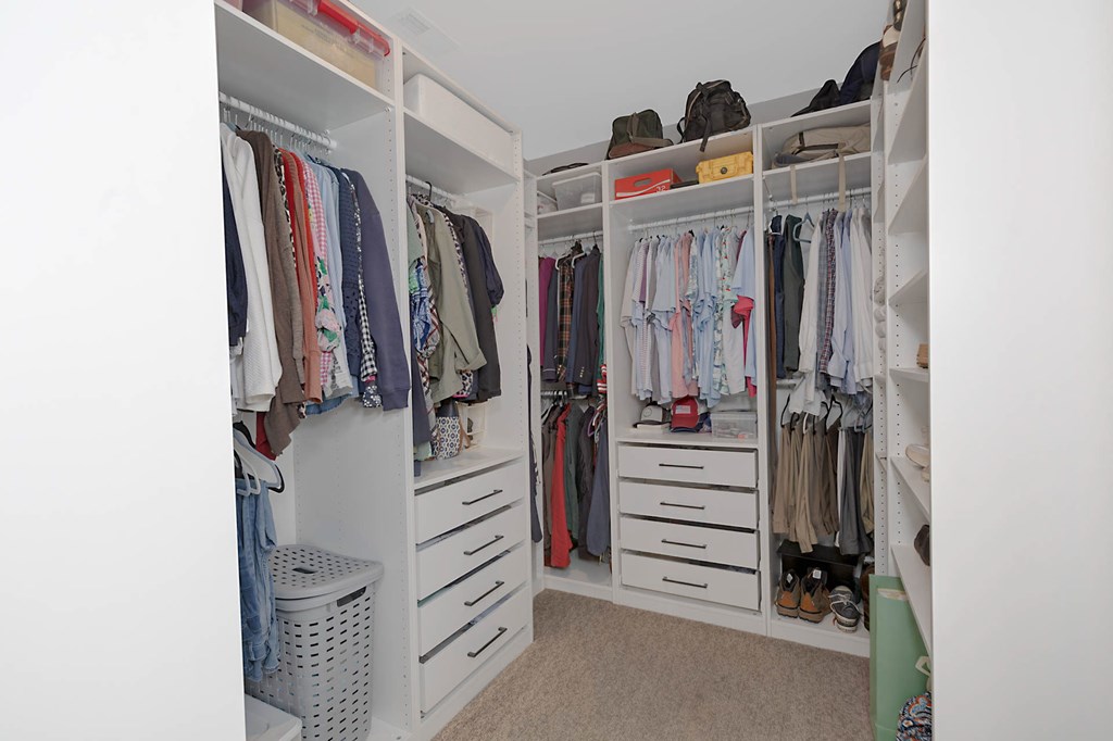 6712 Bridge Way Columbus, GA 31904 - Photo 24 of 36 a view of walk in closet with clothes and shoes