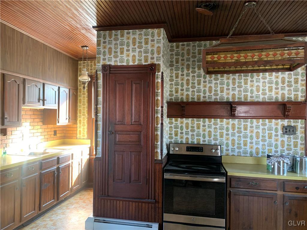 7394 Springhouse Road New Tripoli, PA 18066 - Photo 5 of 7 a kitchen with a stove and a sink