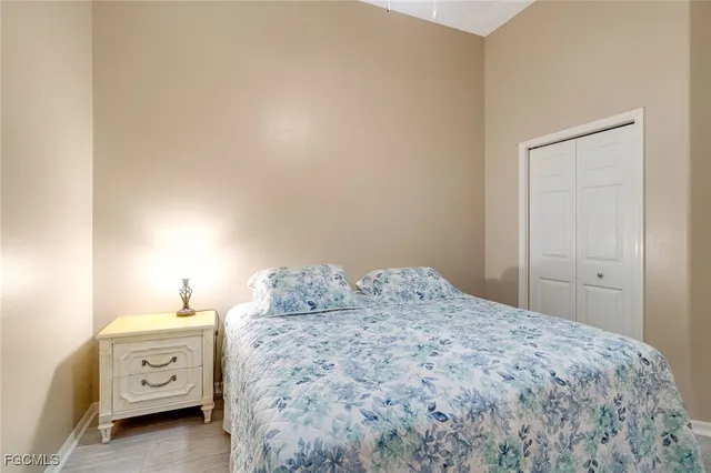 a bedroom with a bed and a closet