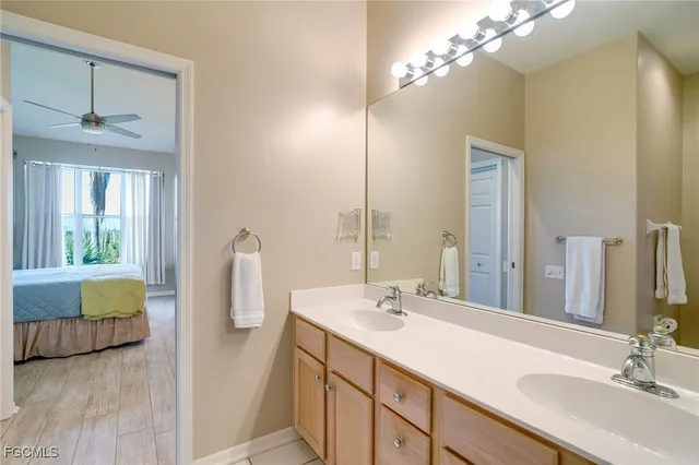 a bathroom with a double vanity sink and a mirror