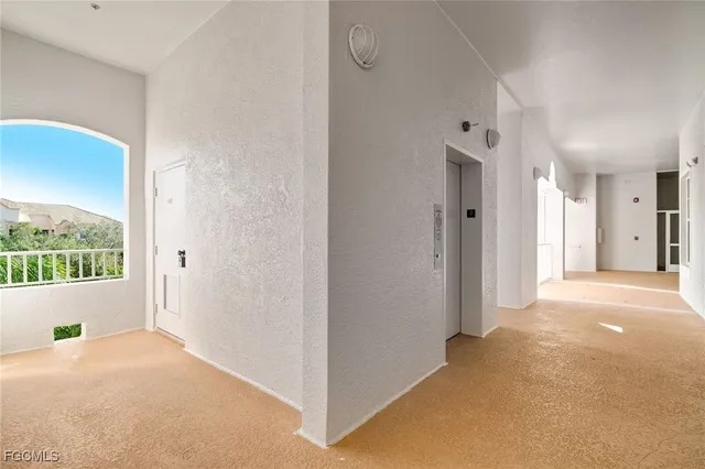 a view of livingroom with furniture and front door