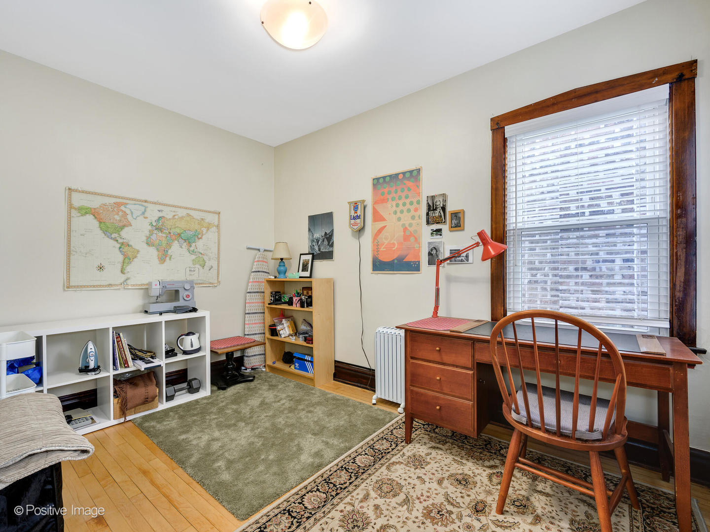 3016 South Throop Street Chicago, IL 60608 - Photo 17 of 32 a living room with furniture a rug and dresser