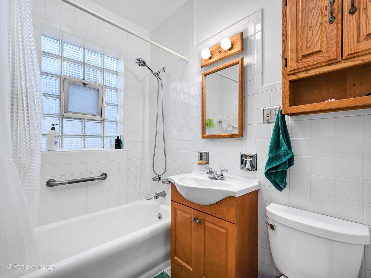 3016 South Throop Street Chicago, IL 60608 - Photo 19 of 32 a bathroom with a sink a toilet and a bathtub