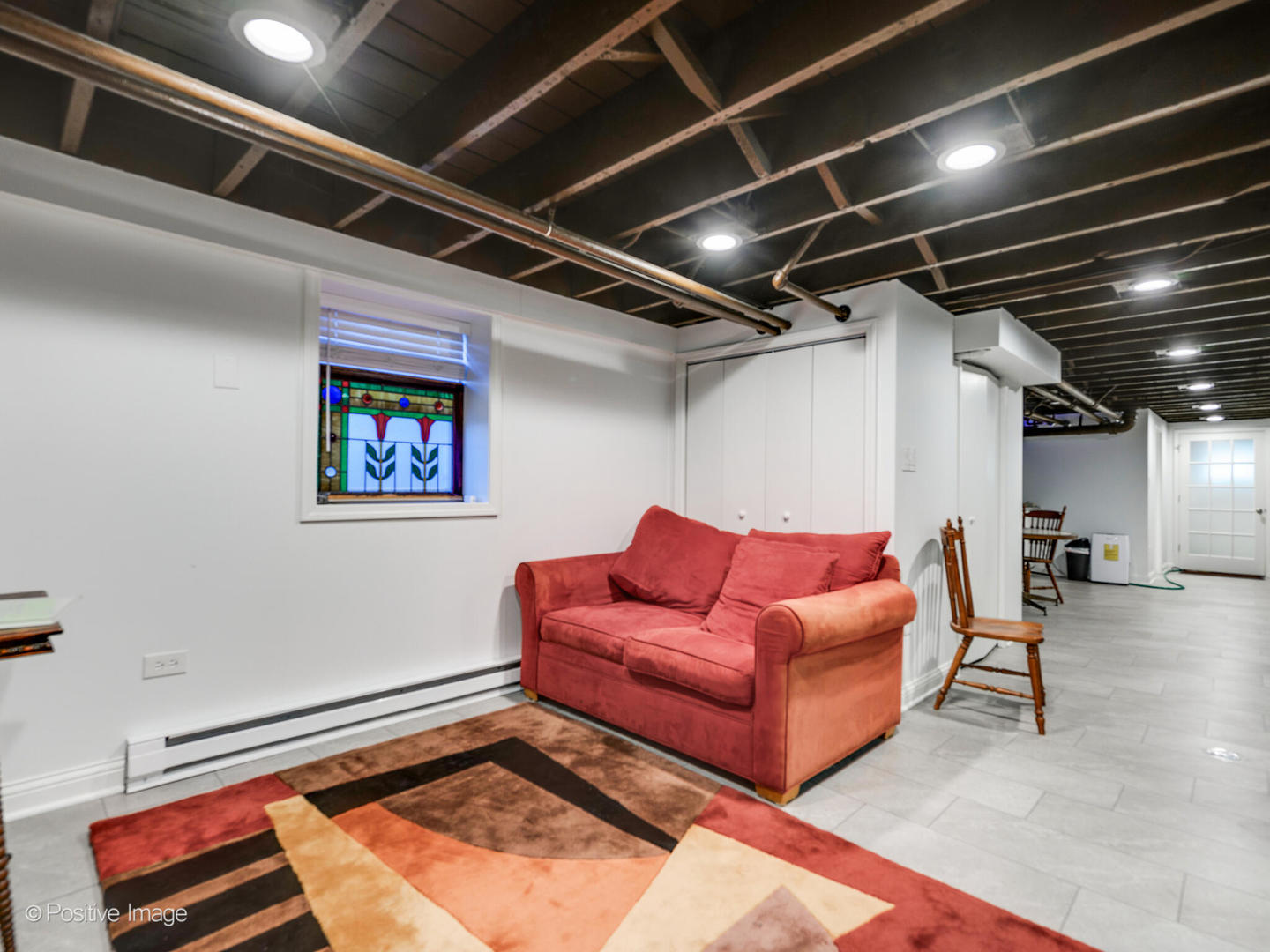 3016 South Throop Street Chicago, IL 60608 - Photo 22 of 32 a living room with furniture and a rug