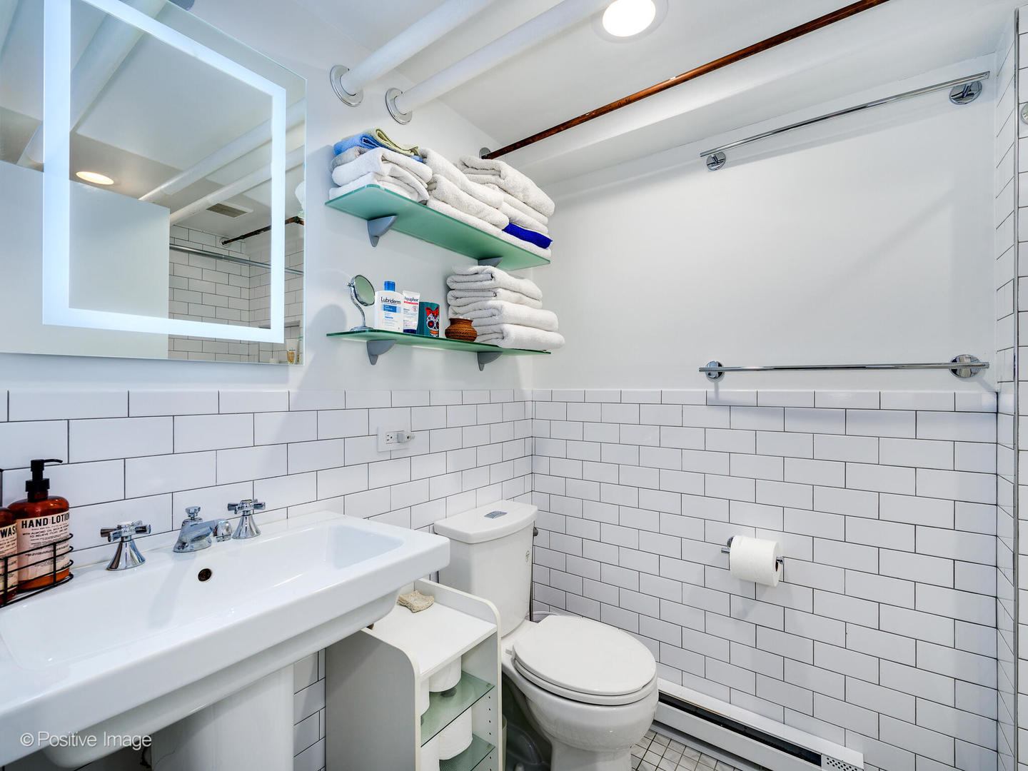 3016 South Throop Street Chicago, IL 60608 - Photo 26 of 32 a bathroom with a sink mirror toilet and shower