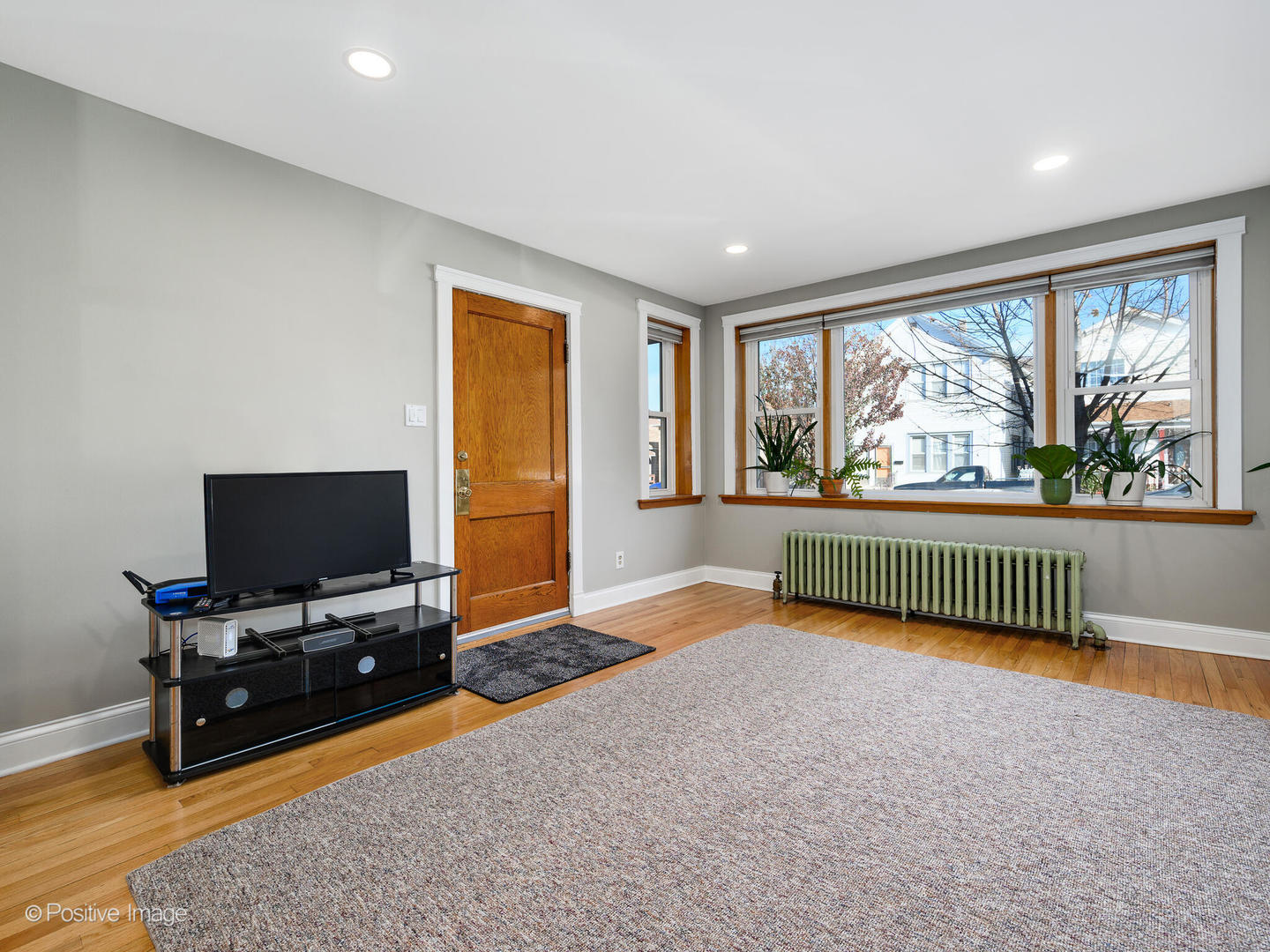 3016 South Throop Street Chicago, IL 60608 - Photo 3 of 32 a view of a livingroom with workspace and a window