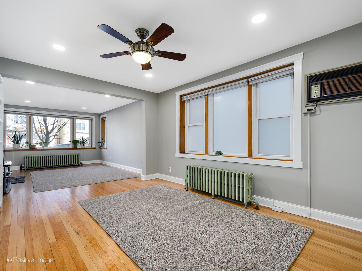 3016 South Throop Street Chicago, IL 60608 - Photo 4 of 32 wooden floor in an empty room with a window