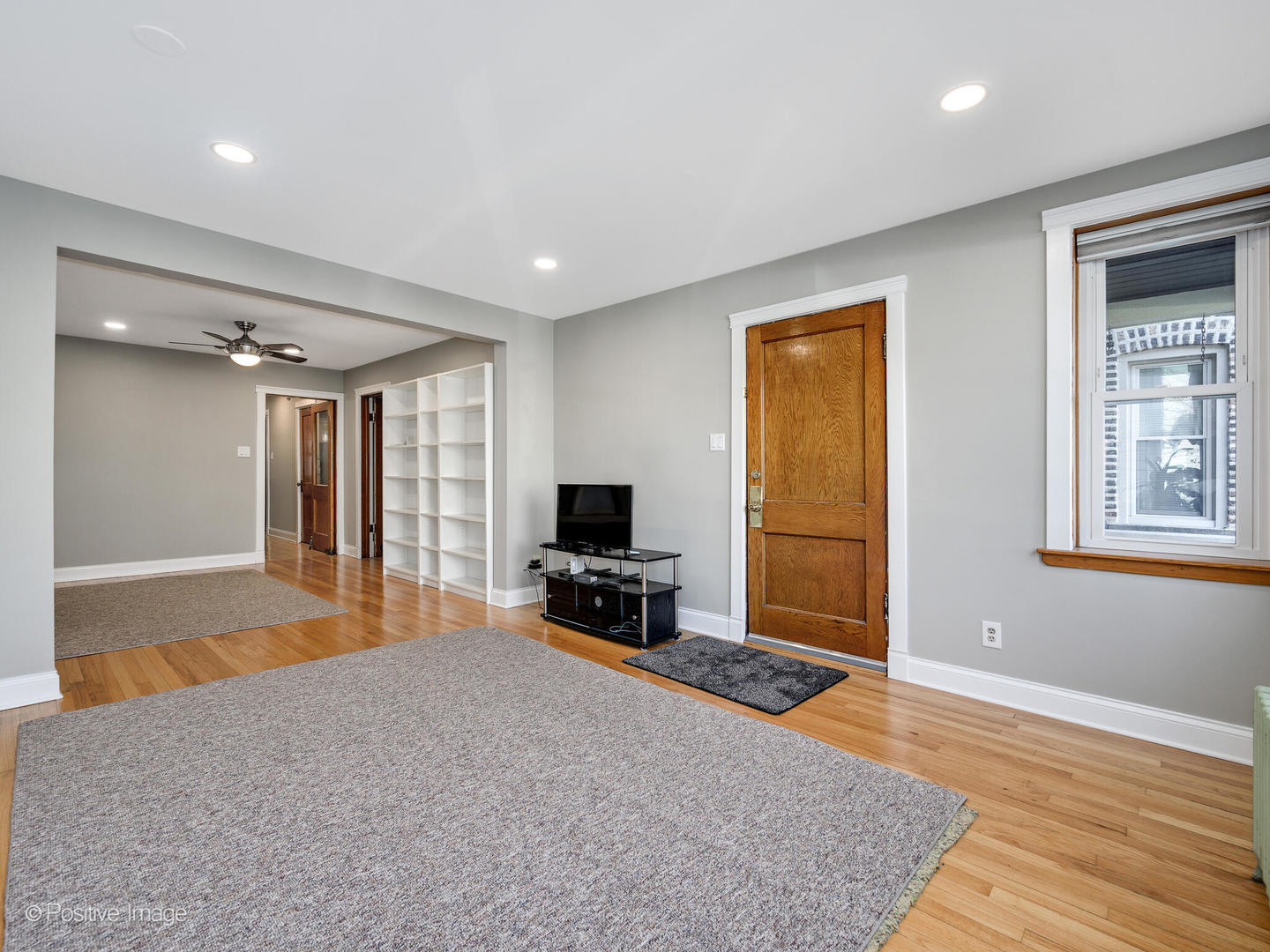 3016 South Throop Street Chicago, IL 60608 - Photo 6 of 32 a living room with furniture and a flat screen tv