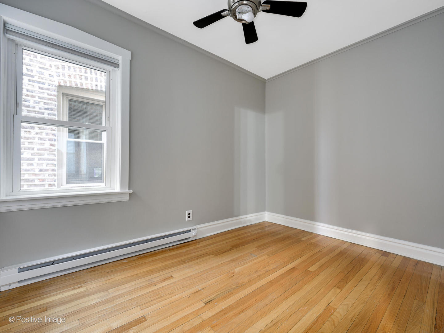 3016 South Throop Street Chicago, IL 60608 - Photo 10 of 32 wooden floor in an empty room with a window