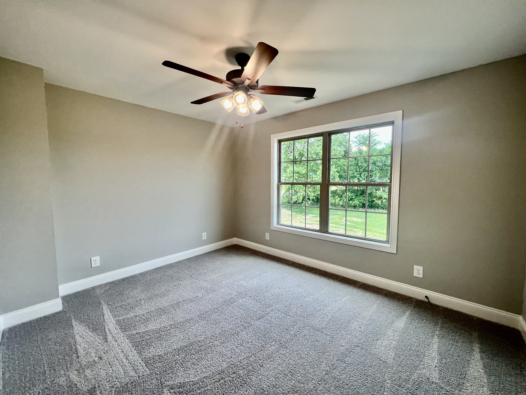 557 Hiwassee Road Lebanon, TN 37087 - Photo 23 of 27 an empty room with a window and a fan