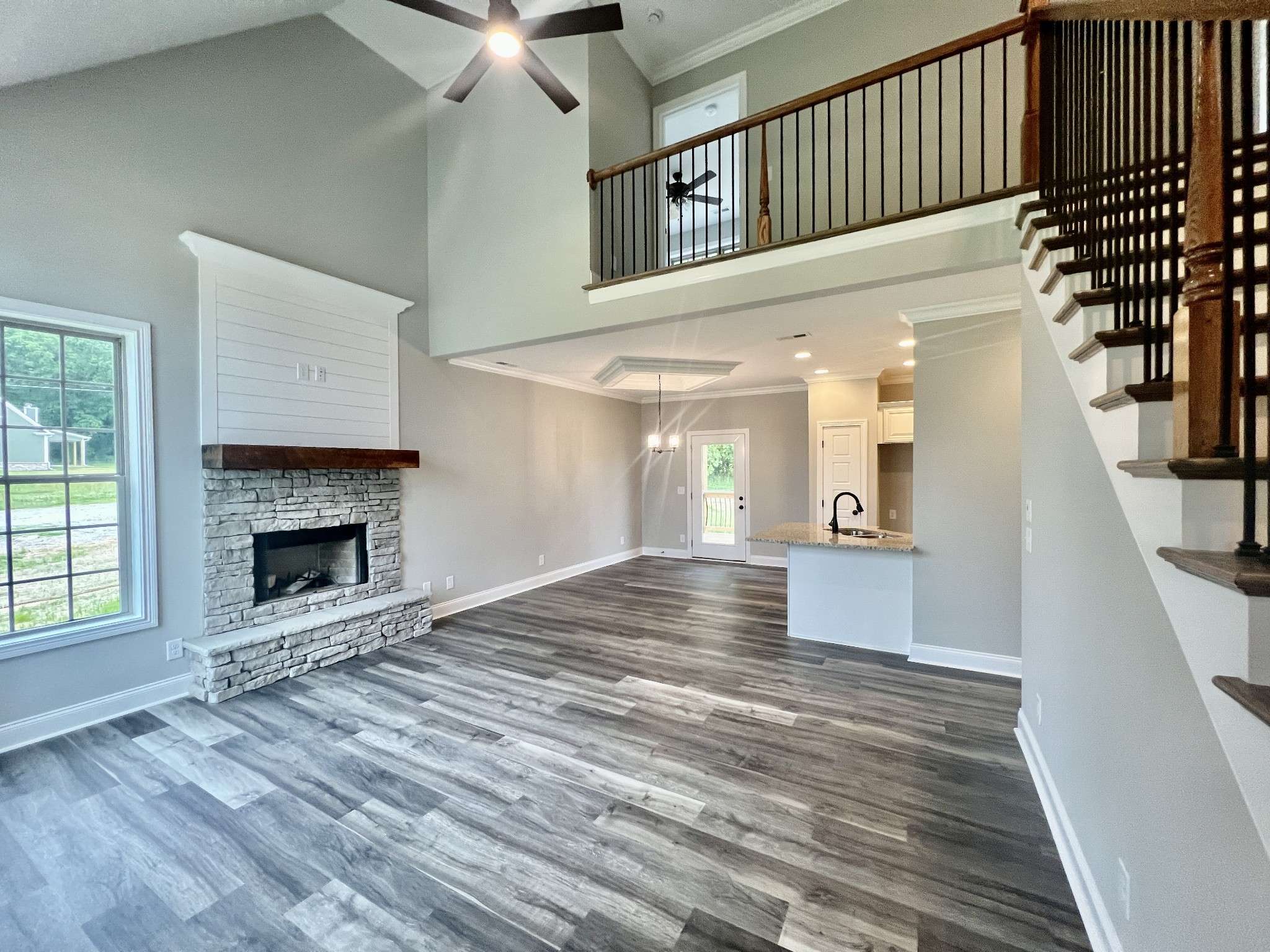 557 Hiwassee Road Lebanon, TN 37087 - Photo 3 of 27 a view of a hallway with wooden floor a fireplace and entryway