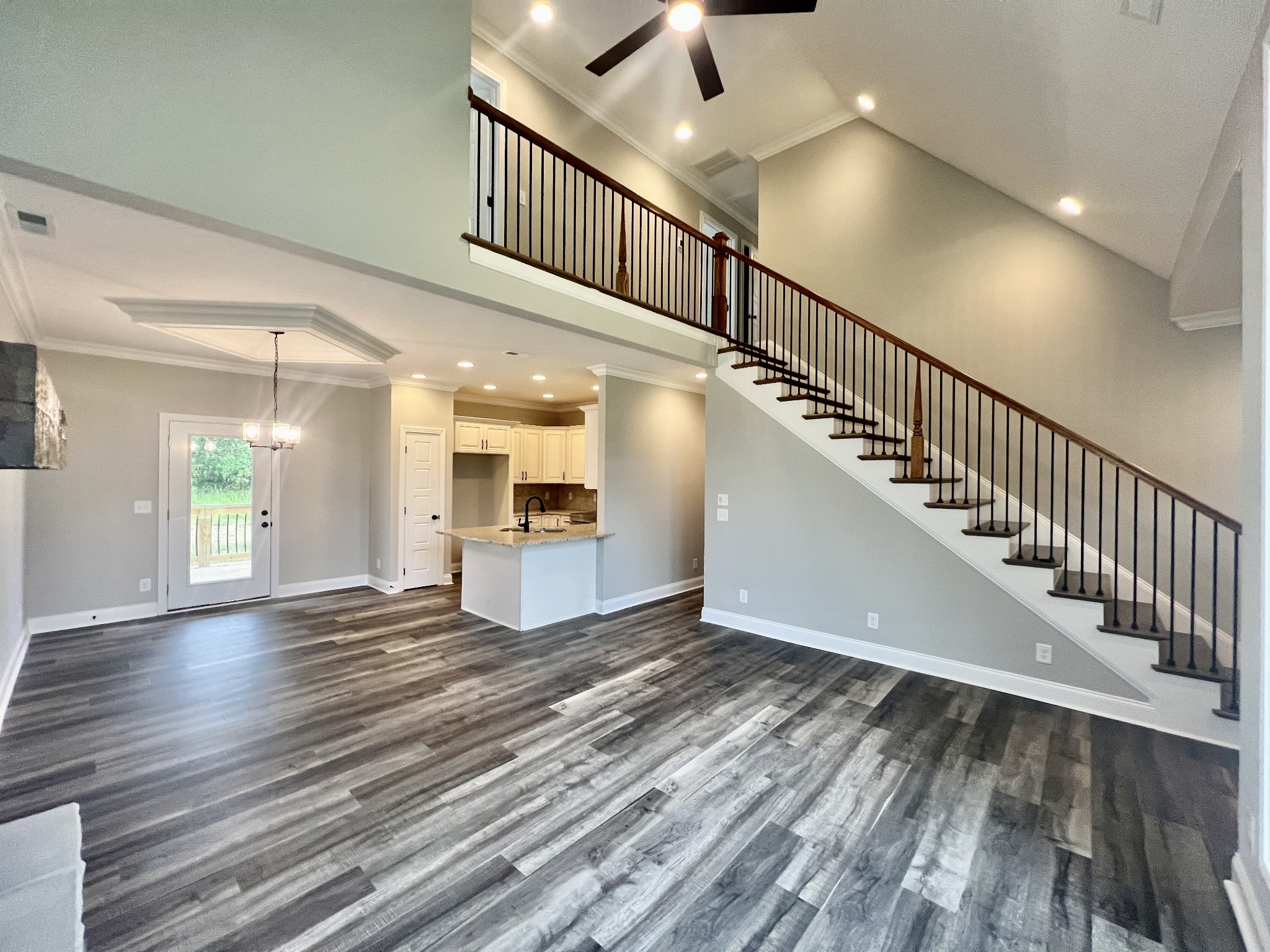 557 Hiwassee Road Lebanon, TN 37087 - Photo 4 of 27 a view of a hallway with wooden floor and staircase