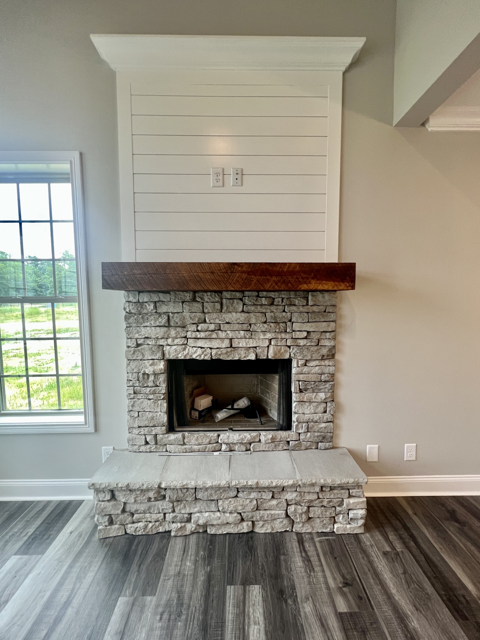 557 Hiwassee Road Lebanon, TN 37087 - Photo 6 of 27 a living room with a fireplace and a wooden floor
