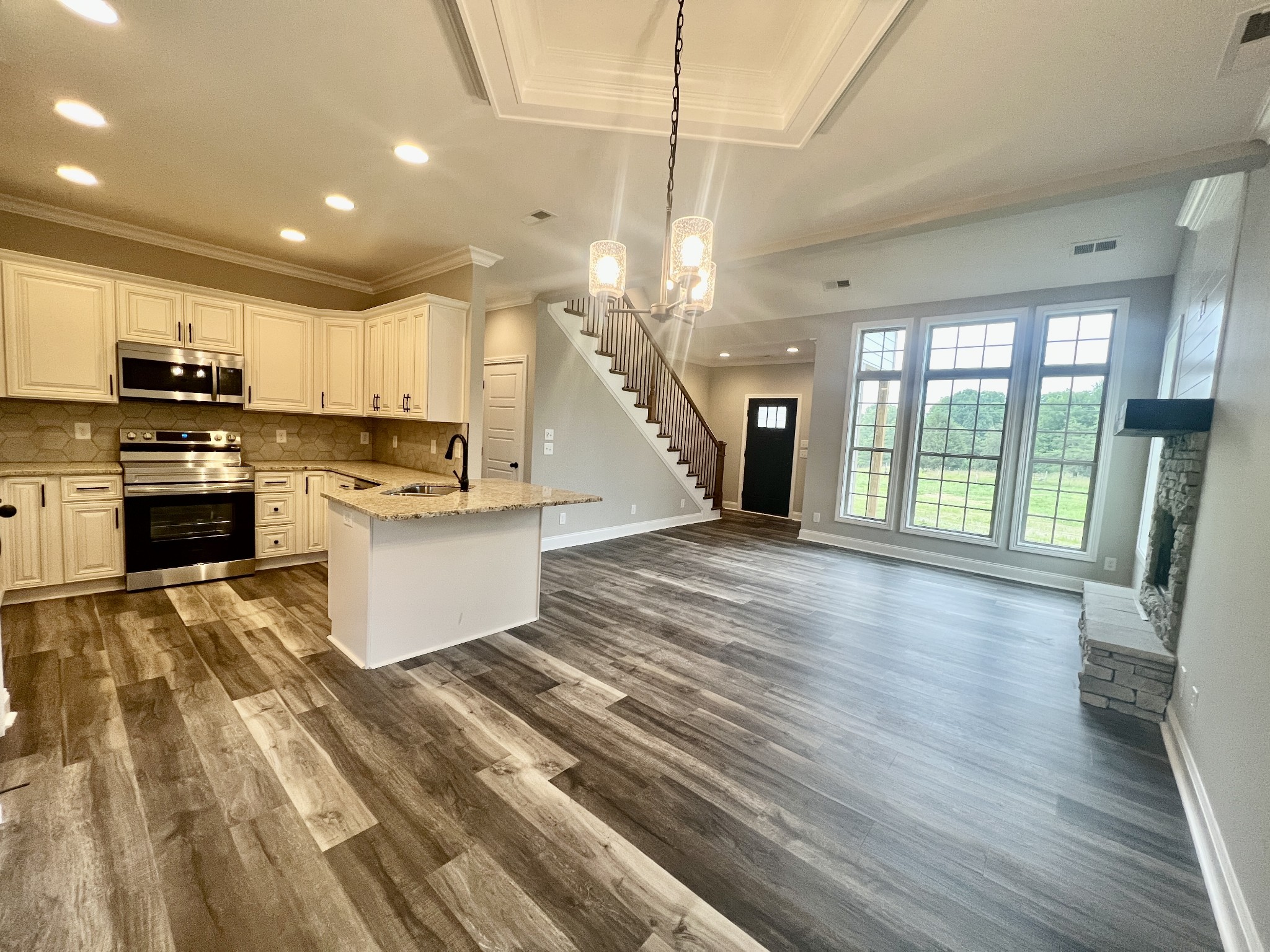 557 Hiwassee Road Lebanon, TN 37087 - Photo 9 of 27 a view of kitchen with microwave a stove top oven and cabinets