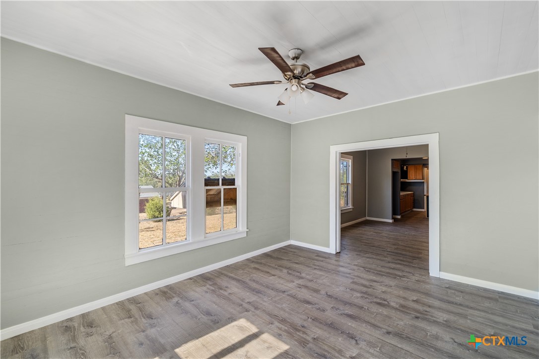 2205 Meyersville Road Meyersville, TX 77974 - Photo 11 of 22 a view of a big room with wooden floor closet and windows