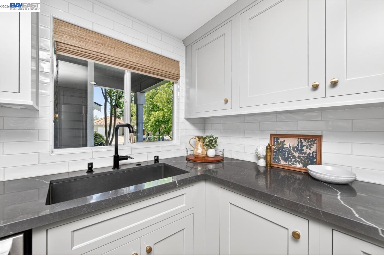 308 Mulqueeney Street Livermore, CA 94550 - Photo 13 of 51 a sink with white cabinets and a window
