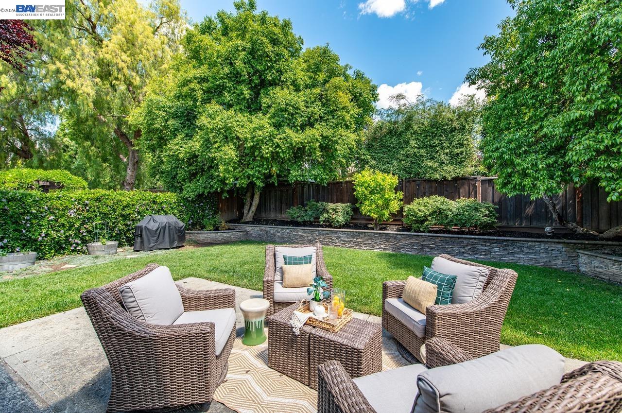 308 Mulqueeney Street Livermore, CA 94550 - Photo 27 of 51 a view of a patio with couches chairs and a yard