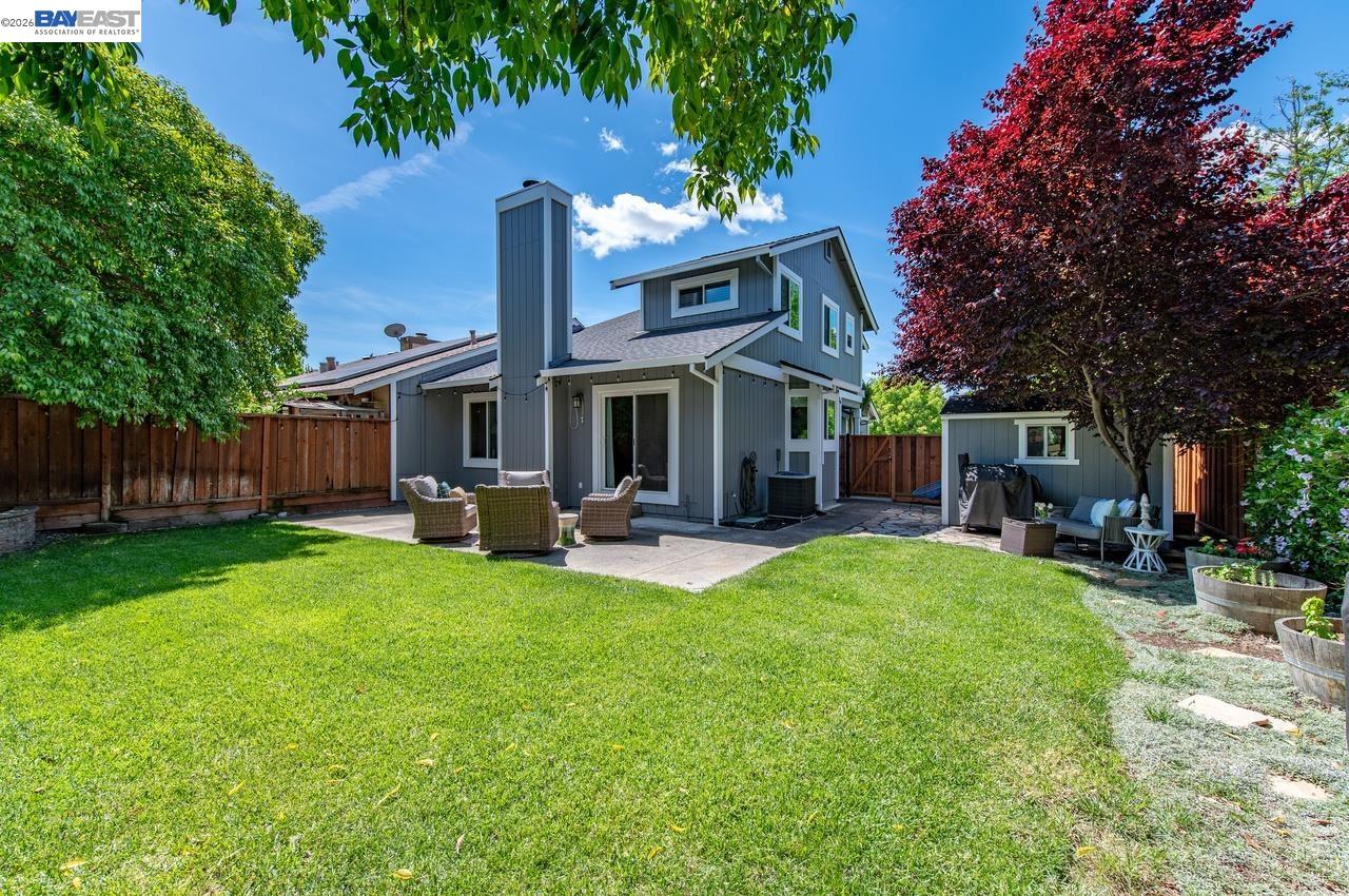 308 Mulqueeney Street Livermore, CA 94550 - Photo 30 of 51 a front view of a house with swimming pool garden and patio