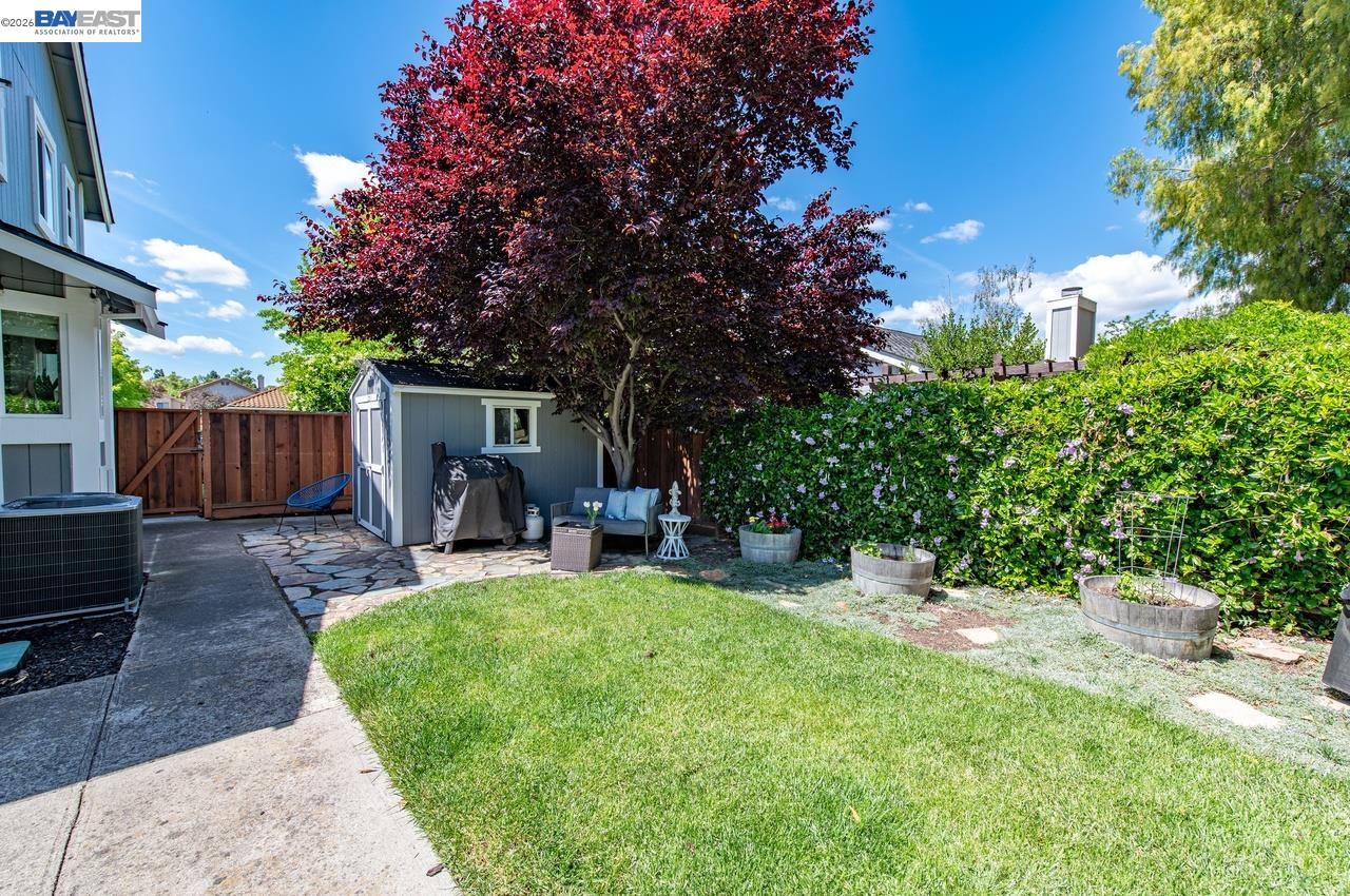 308 Mulqueeney Street Livermore, CA 94550 - Photo 31 of 51 a view of a house with a patio and a yard