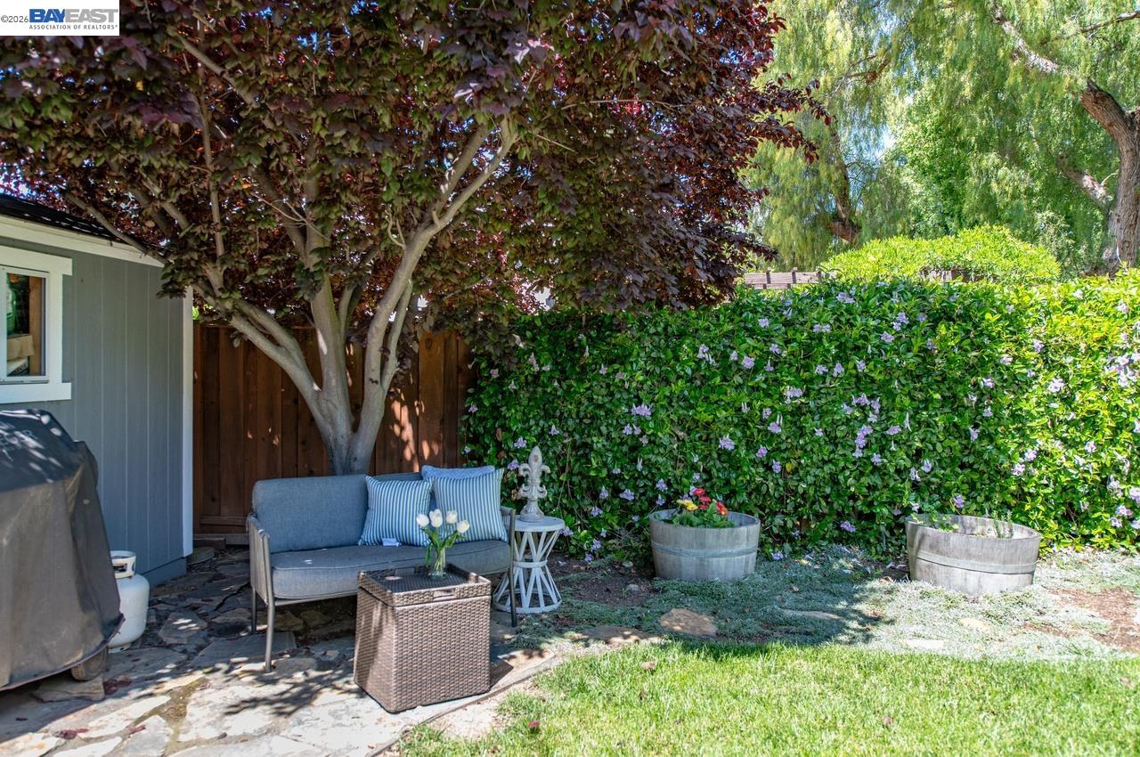308 Mulqueeney Street Livermore, CA 94550 - Photo 36 of 51 a patio with glass top table and chairs