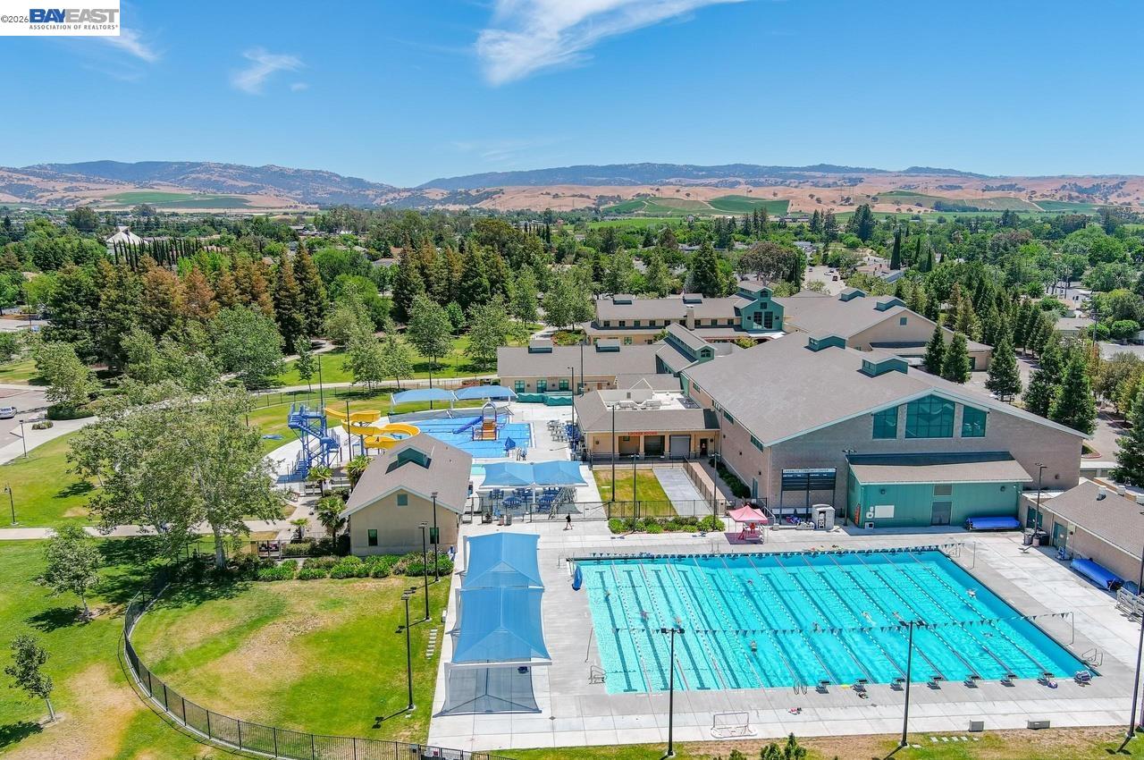 308 Mulqueeney Street Livermore, CA 94550 - Photo 46 of 51 a view of a swimming pool with a patio and a garden