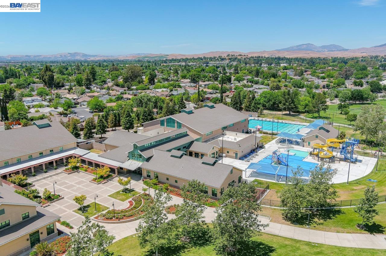 308 Mulqueeney Street Livermore, CA 94550 - Photo 50 of 51 an aerial view of a swimming pool and mountain view in back