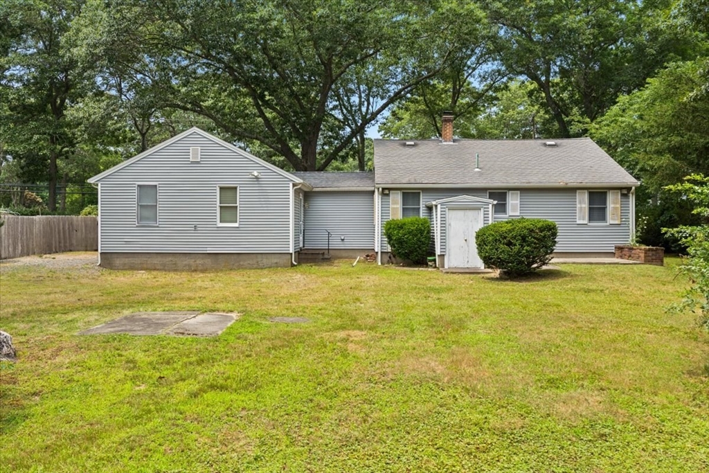 435 Sandwich Road Falmouth, MA 02536 - Photo 7 of 29 a house that has a tree in front of it