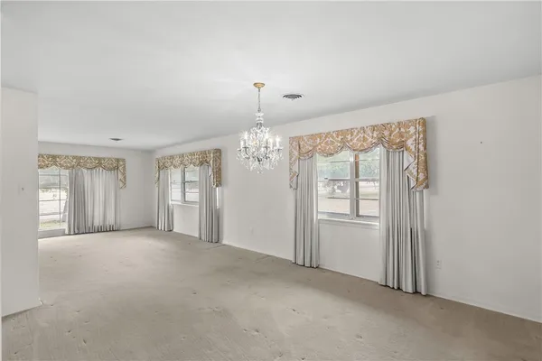 a large kitchen with granite countertop a sink stainless steel appliances and cabinets