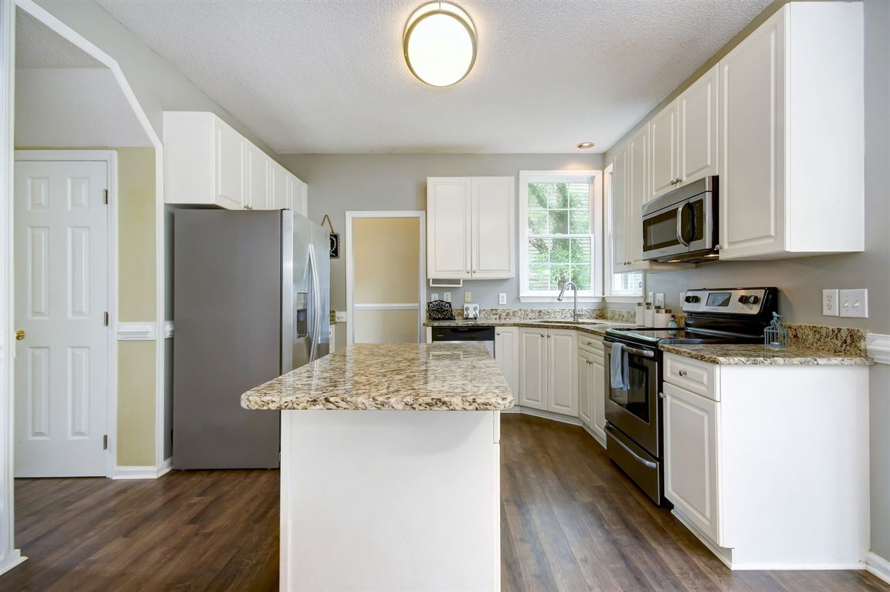 5300 Halcott Court Raleigh, NC 27613 - Photo 9 of 23 Very large kitchen and home is wired through the main living floor with window sensors through ADT. Eat in kitchen with breakfast room so plenty of space for family and friends! Kitchen