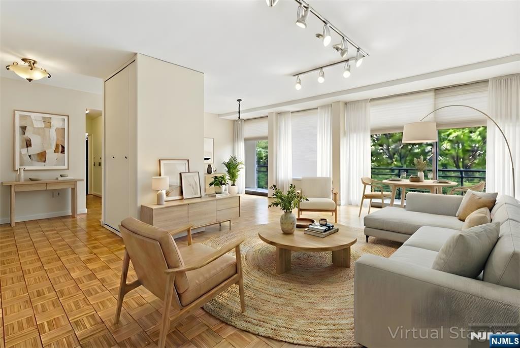 a living room with furniture and a large window