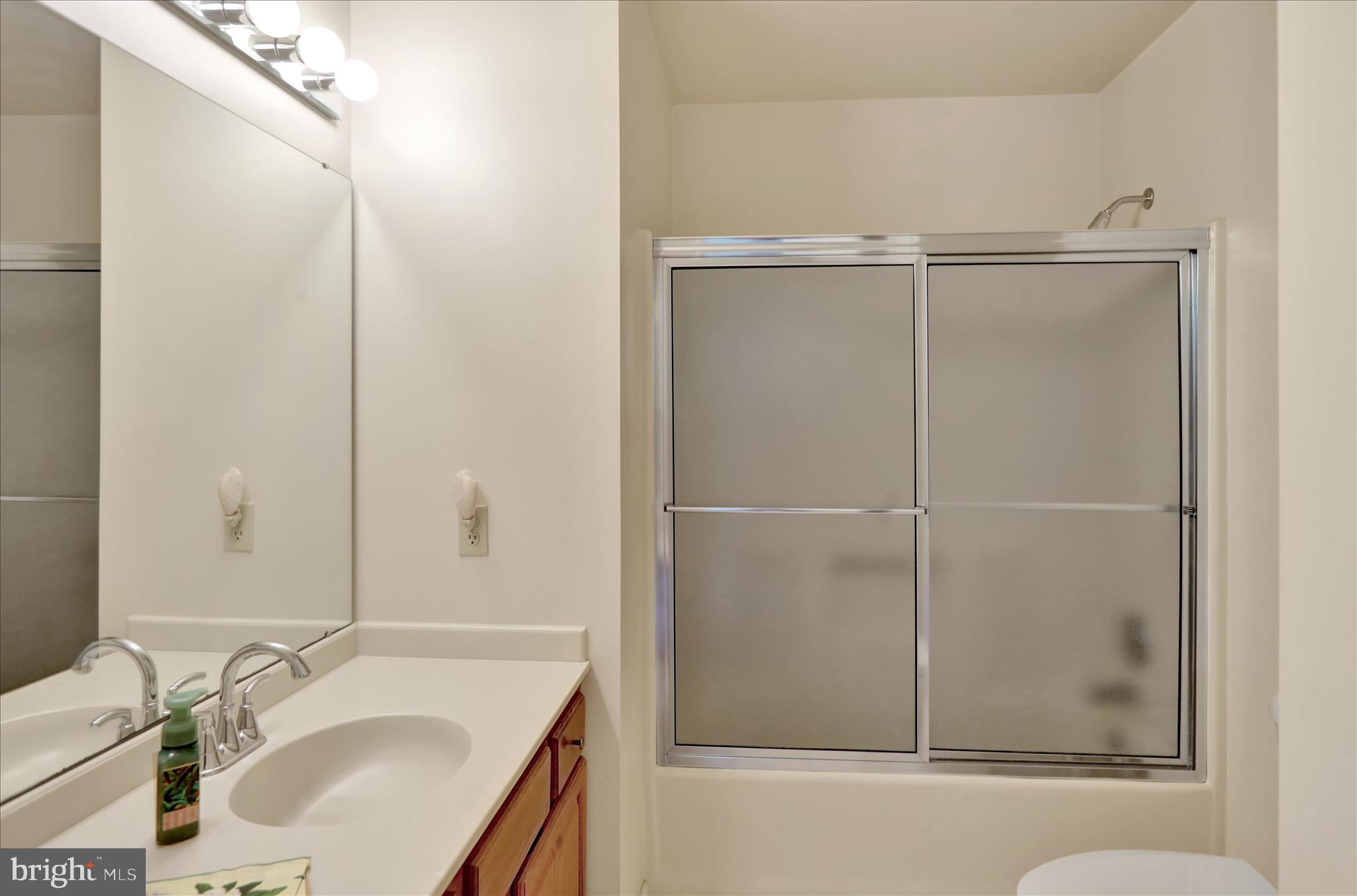 146 Heather Lane Reading, PA 19610 - Photo 17 of 25 a bathroom with a granite countertop shower sink vanity and mirror