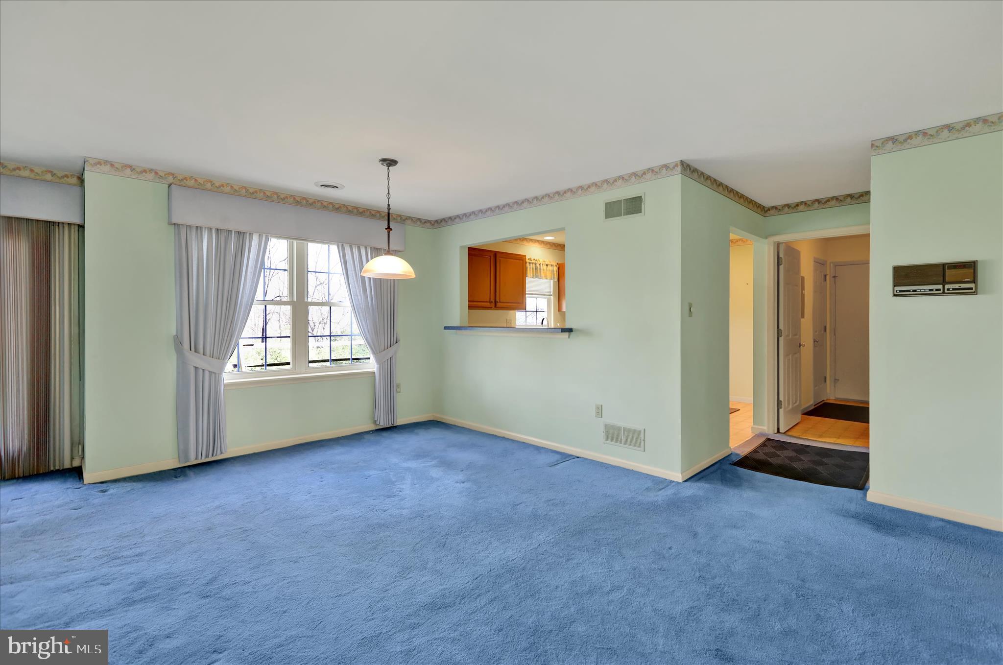 146 Heather Lane Reading, PA 19610 - Photo 5 of 25 a view of an empty room with a window and wooden floor