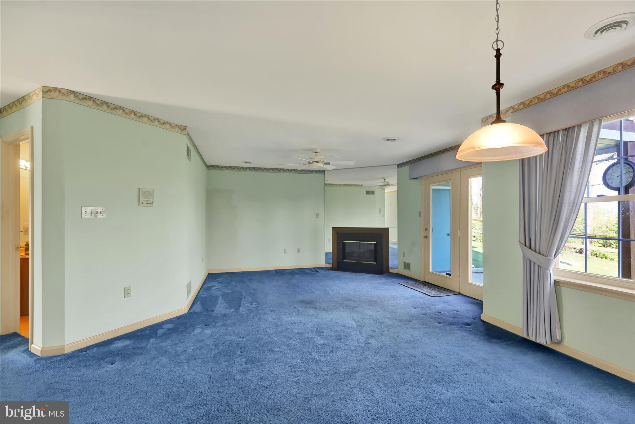 146 Heather Lane Reading, PA 19610 - Photo 6 of 25 a view of an empty room with window and chandelier